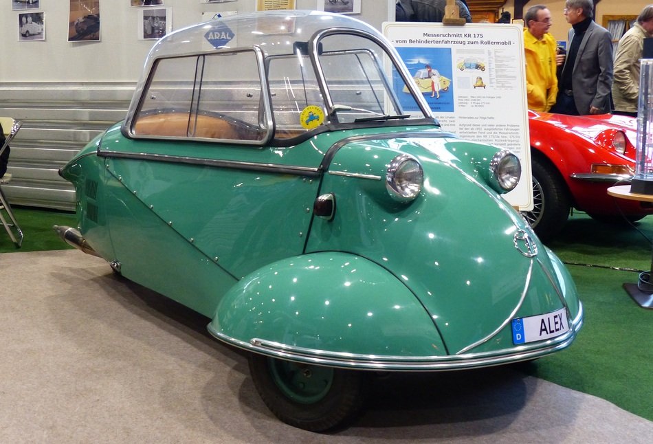 green unusual car at a exhibition