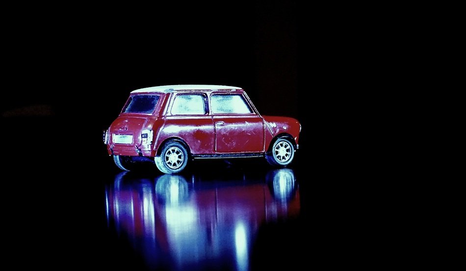 mini cooper in miniature on a black background