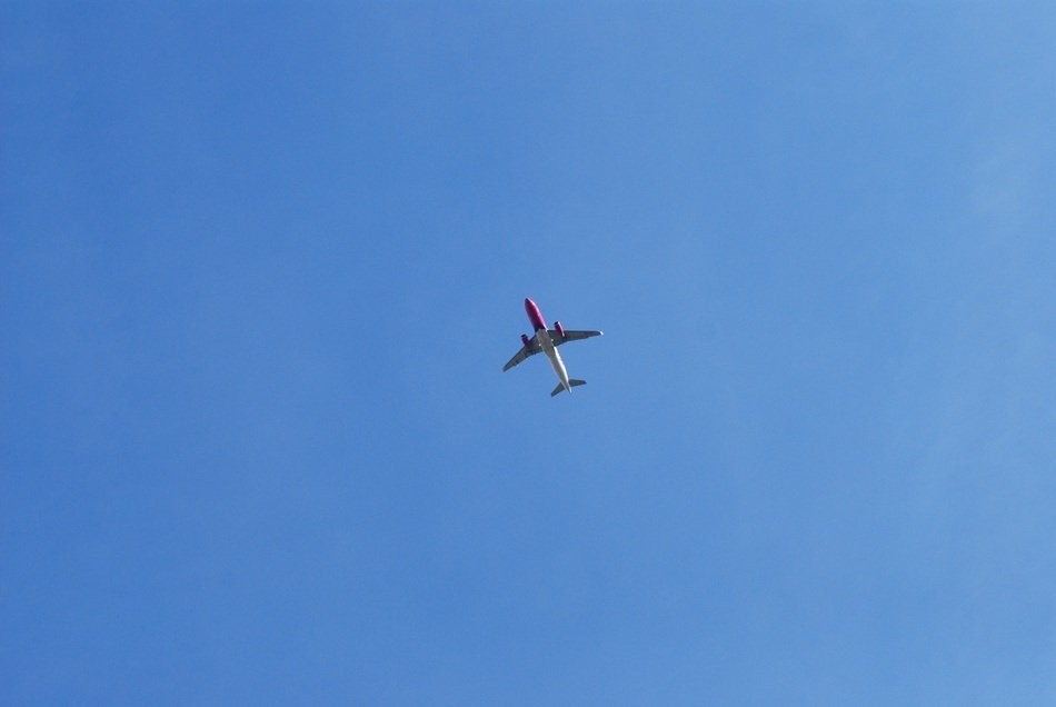 Airplane in the blue clear sky