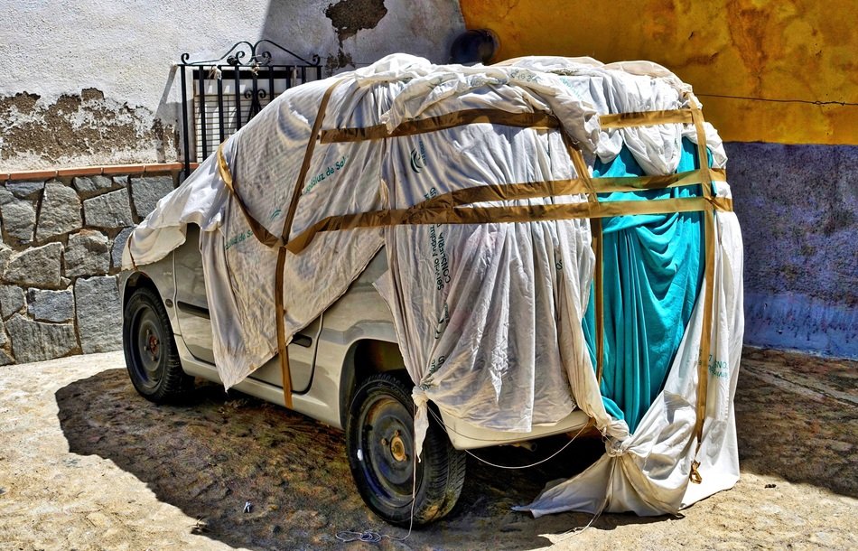 covered car near the building