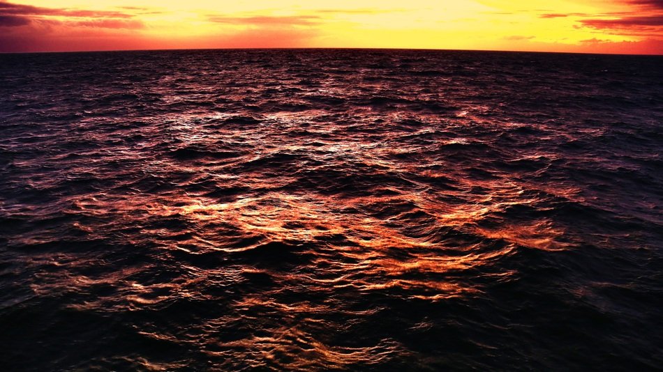 crimson sunset over the ocean waves