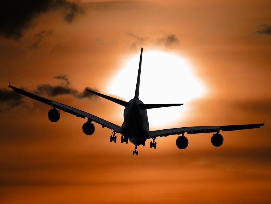 plane at sunset in the summer sky