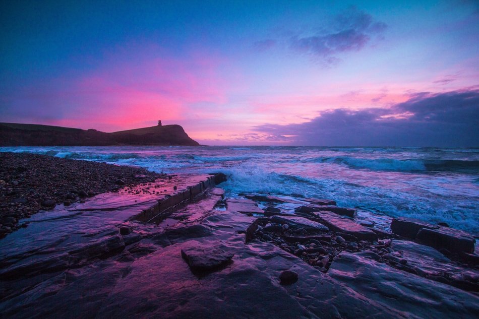 Jurassic coast under a purple sky