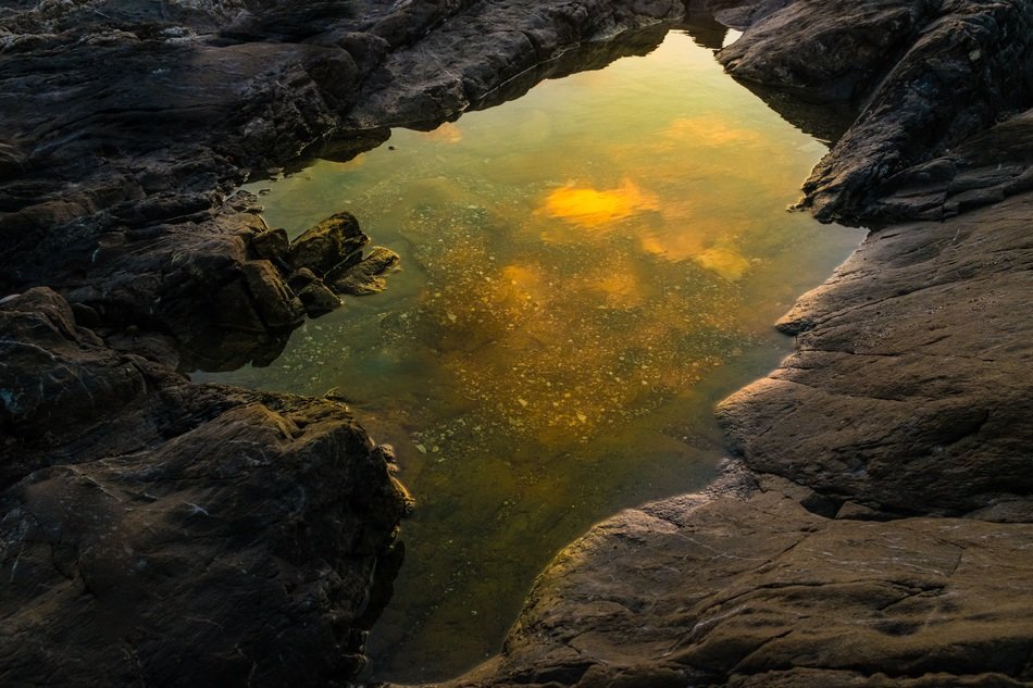 reflection of the outgoing sun on the water