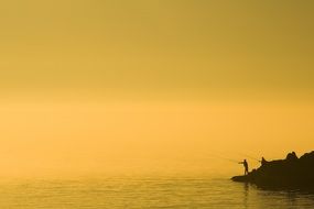 fisherman on the island at dusk