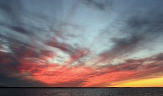 landscape of bright red and yellow sunset on a sky