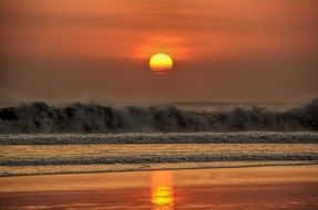 orange sunset over the beach in bali
