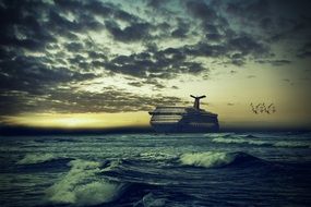 distant view of the ferry at sea at evening dusk