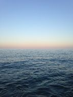 calm ocean surface and blue sky