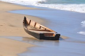 wooden boat on a sandy beach in puerto rico