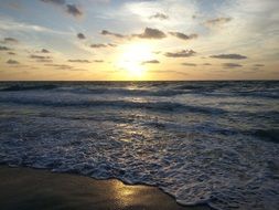 ocean surf at sunrise