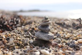 stone tower on a pebble beach close-up