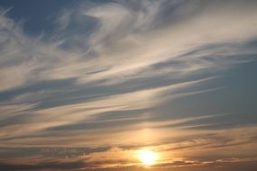 evening cirrus clouds and bright sun