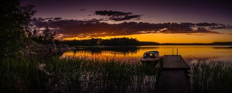 boat near the shore of the Baltic Sea during sunset