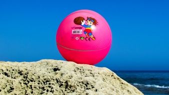 Picture of the pink ball on a beach