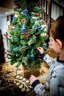 baby and christmas tree