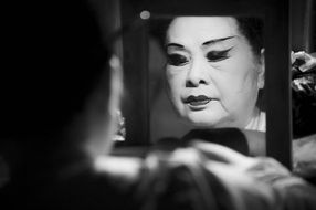 reflection in the mirror of an opera singer