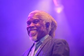 Billy Ocean smiles at a concert