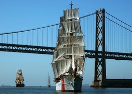 landscape of three-masted ship near a bridge in san francisco