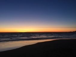 beach near the ocean at dusk