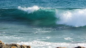 coastal turquoise waves in cyprus on a sunny day