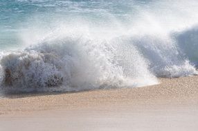 splash from the waves on a sandy beach in Cape Verde