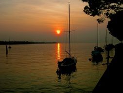 landscape of sunset over a lake in italy