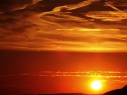 bright yellow sun at sunset sky