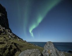 landscape of dancing aurora borealis in Lofoten