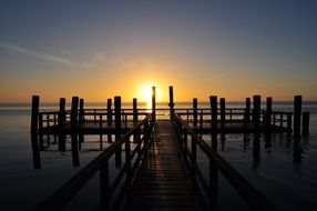 wooden pier on sea at Sunrise, germany, nordfriesland