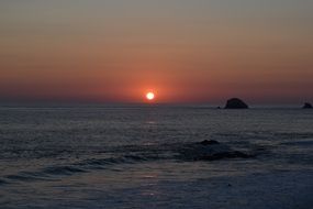 sunset over zipolite beach