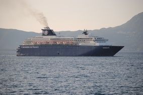 Cruise ship on water in view of coast