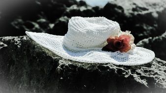 vintage white hat on stone