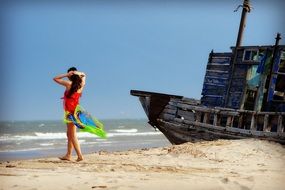 girl on the beach near the ship