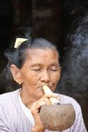 Woman smoking in Burma