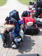 travel backpacks on the sidewalk on a sunny day
