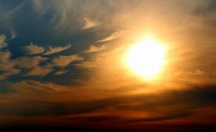 glowing yellow sun in the evening