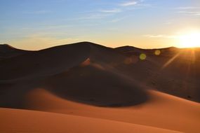 Landscape with the sunset on Sahara Desert