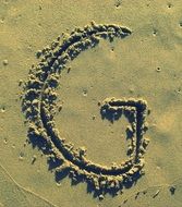 Letter G on the Sand