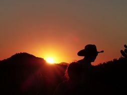 silhouette of a cowboy in the wild west
