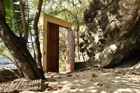 wooden front door on a tropical beach