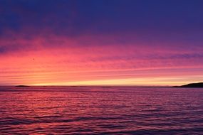 pink bright sunset over the waters in greenland