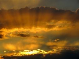 yellow sunset between clouds