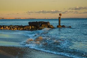 Beach Evening with colorful sunset above the water