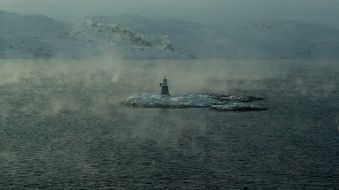 lighthouse in foggy Fjord, Norway, Kirkenes