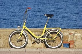 yellow bike on the waterfront