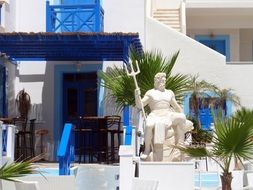 statue of neptune on karpatos island in Greece