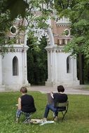 artists in front of historical landmarks