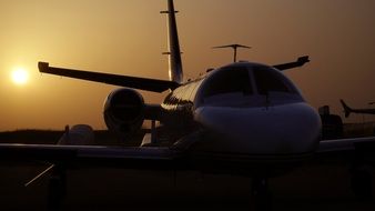 airplane at the airport against the evening sky