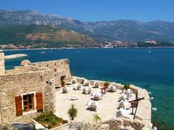 tables with chairs in a beach restaurant